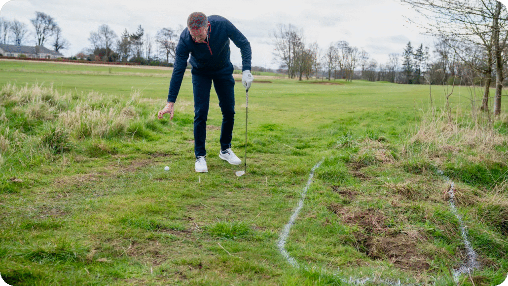 golf cart gps system golfer taking a drop