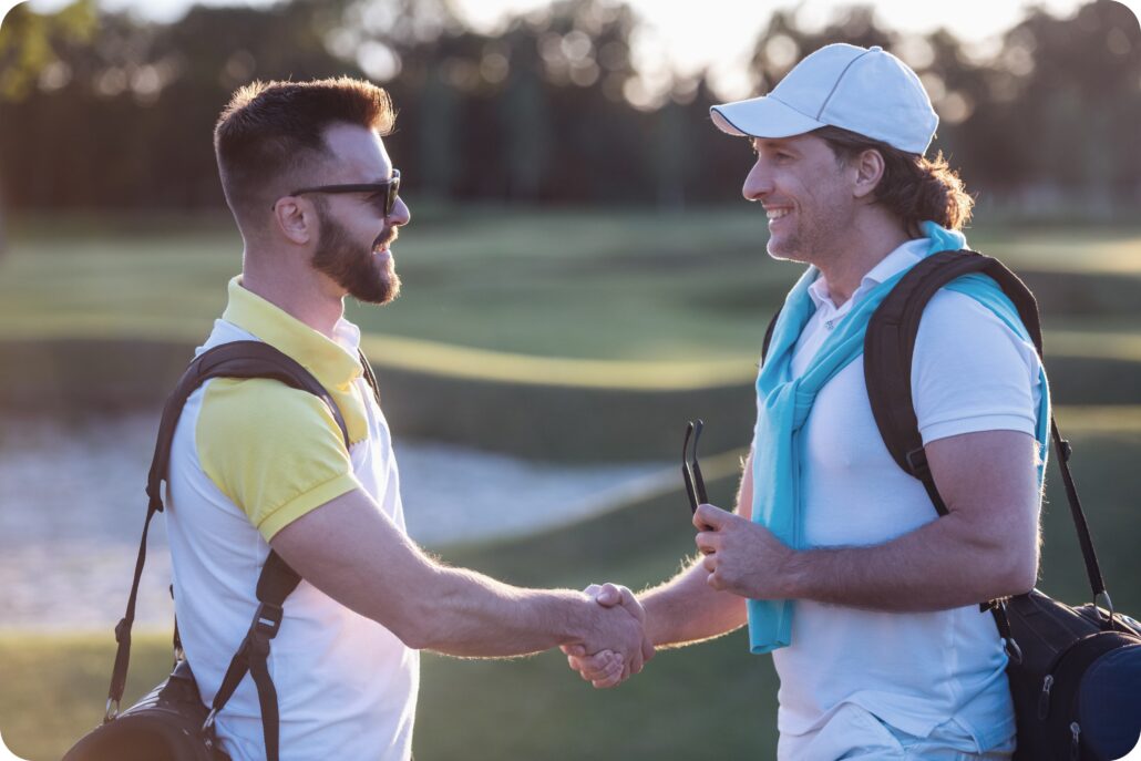 golfcart gps system golfers shaking hands
